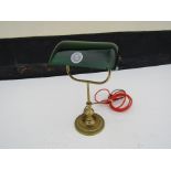 A green shaded bankers lamp,