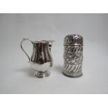 A silver scroll handled cream jug (London 1929) with a Victorian silver repousse work sugar caster