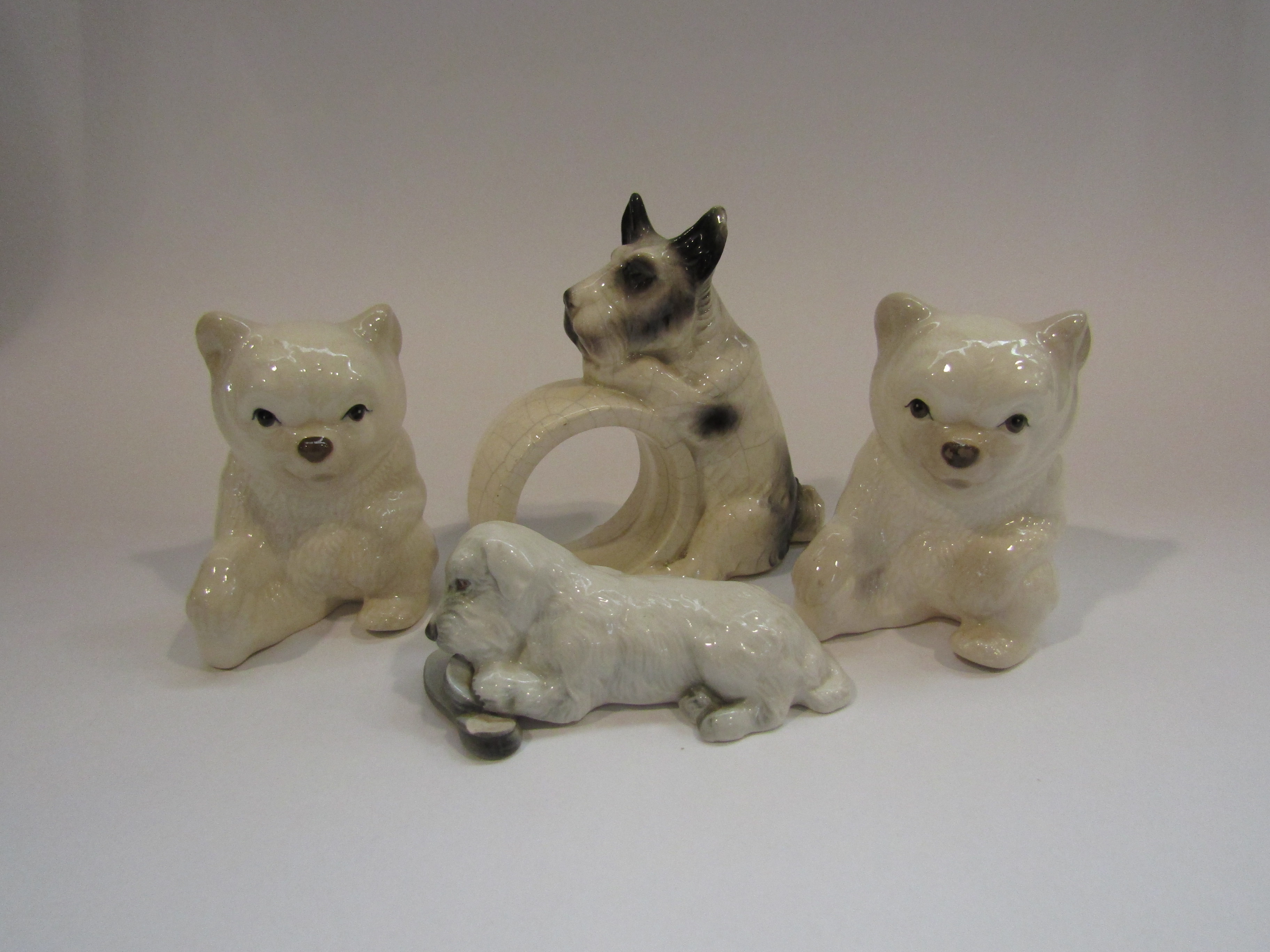 A pair of Szeiler china bears, dog napkin holder,