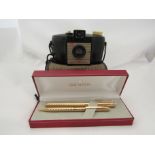 A Schaeffer gold coloured propelling pencil and fountain pen set and a Kodak Brownie camera,