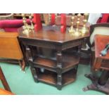 A 17th Century style oak three tier credence table the carved frieze over turned and square legs,