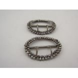 A pair of vintage two pronged steel-cut shoe buckles