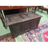 A Victorian decoratively carved oak coffer,