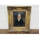 A 19th Century English School portrait of elderly lady wearing a bonnet and black dress,