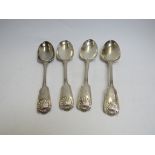 A set of four Chawner & Co (George William Adams) silver serving spoons with shell form and vehicle