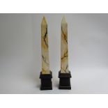 A pair of Holkham pottery Egyptian obelisks 44cm tall