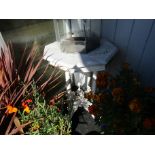 An octagonal marble top conservatory table