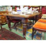 An early Victorian mahogany extending dining table on melon fluted legs to castors,