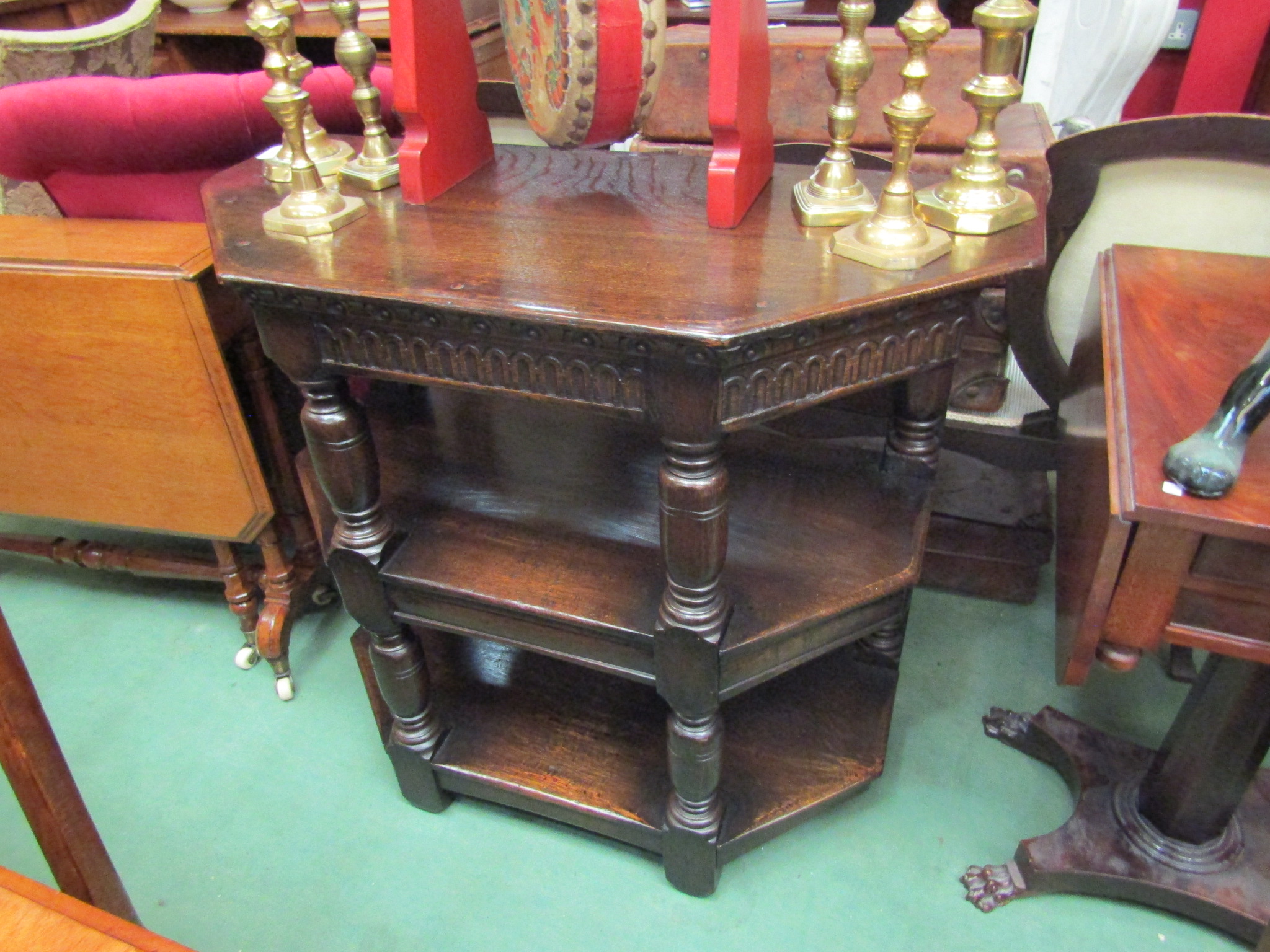 A 17th Century style oak three tier credence table the carved frieze over turned and square legs, - Image 2 of 2