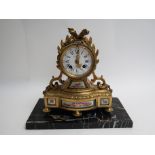 A late 19th Century French Andre Hoffman ceramic and ormolu clock