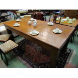 A burr walnut patch veneered dining table,