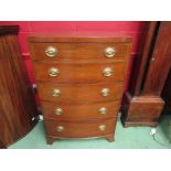 An Edwardian mahogany bow fronted chest of five straight drawers, brass oval plate handles,