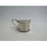 A Victorian silver mustard pot of large proportions, octagonal form with engraved panels,