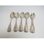 Five various silver dessert spoons with shell form and vehicle design engraved terminals,