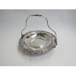 A Sing Fat Chinese silver bonbon dish with bird engraving and swing handle, 21cm diameter,
