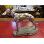 A gilt figure of a lurcher,