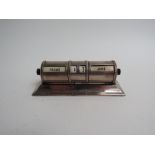 A silver Padgett & Braham Ltd barrel form desk calendar, London 1936, 13.