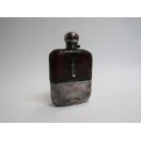 A snake skin covered hip flask with engraved lid,