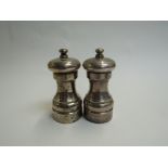 A John Bull Ltd silver pair of salt and pepper grinders,