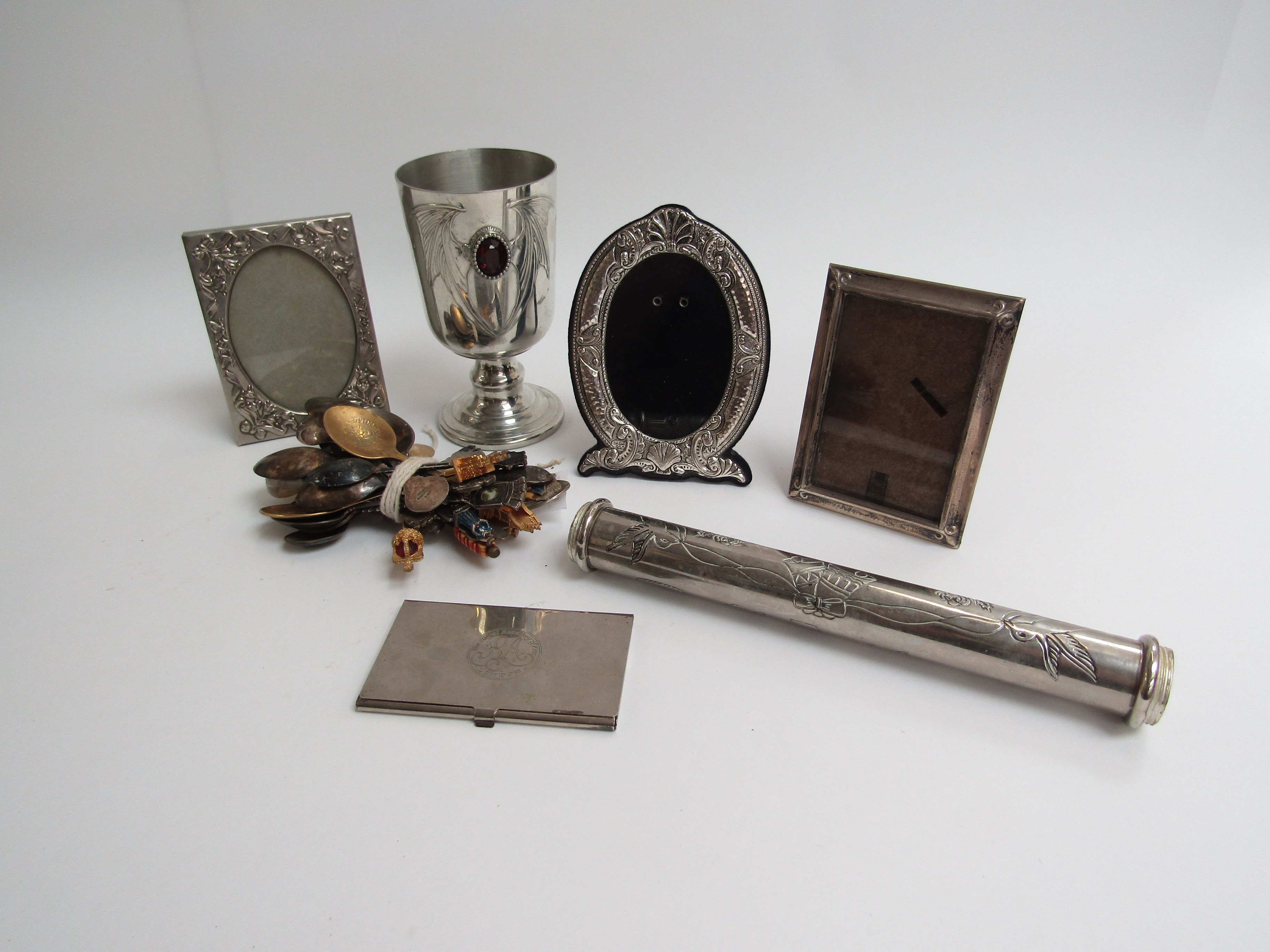 Souvenir spoons, silver and plated photograph frames,