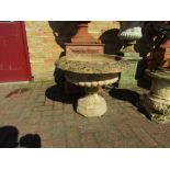 A pair of urns on socle's,