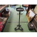 A wrought iron jardiniere stand,