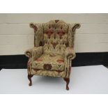 Plumbs Silk upholstered wingback armchair with button back, discolouration to head rest and arms,