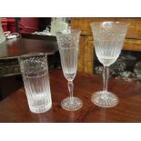 A part suite of crystal glasses with leaf frieze including champagne, wine and highball glasses,