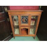 A Victorian inlaid mahogany display cabinet, central stained glass door revealing drawers,