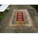 A handwoven Caucus rug with light blue colouring,