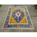 A handwoven Caucus rug with deep blue colouring,