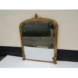 A 19th Century gilt domed top overmantel mirror with acanthus and swag embellishment,