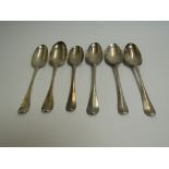 A matched set of six Georgian silver rat-tail dessert spoons, various monograms, makers and dates,
