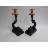 A pair of modern candlesticks in the antique style, Dolphin with acanthus sconce,