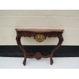 An Indian hardwood console table in the 19th Century style,
