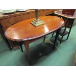 An Edwardian mahogany oval top lamp table on square tapering legs,