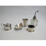 A silver egg cup, mustard, salt atomizer and another salt, various makers and dates,