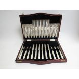 A cased set of silver Cooper Brothers & Sons Ltd mother of pearl dessert knives and forks,