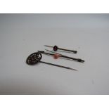 A ruby set tie pin,