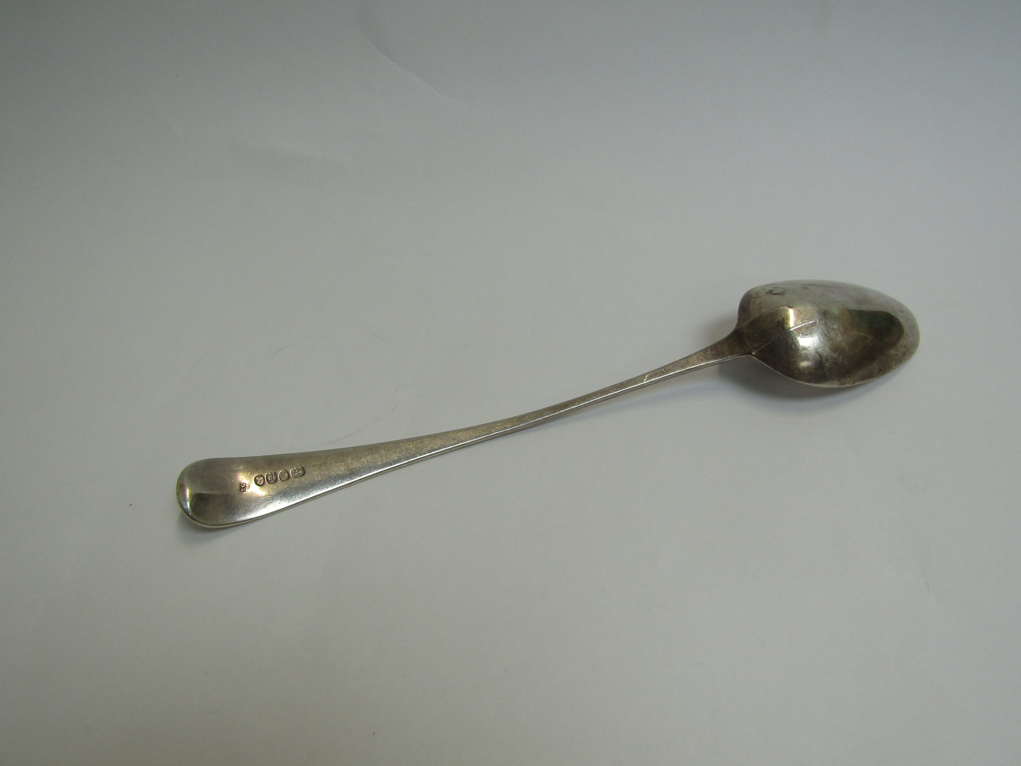 A Samuel Godbehoe and Edward Wigon silver basting/stuffing spoon, London 1799, monogrammed H, - Image 2 of 3