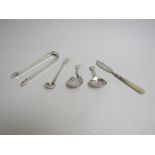 A quantity of silver including caddy spoons, sugar tongs,