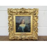 An oil on paper depicting Hon Mrs Savours by V Ward, ornate gilt frame,