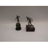 Two football figure trophies,