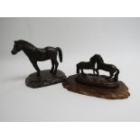 Two cast figures of horses,