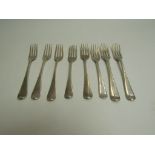 Eight Georgian silver dessert forks, various monograms, makers and dates, marks rubbed,