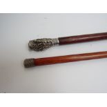 A three piece Indian handled walking cane and another with weave top (2)