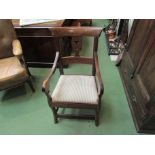 A possibly Welsh carver chair with stripe upholstered seat,