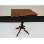 An Edwardian mahogany rectangular topped occasional table with four wrythen column support to