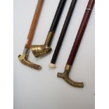 Various walking sticks including pharaoh headed,