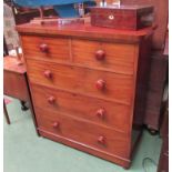 A late Victorian chest of two short over three graduating long drawers with bun handle and turned